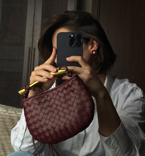 Braided mini Cross body bag with carved handle